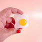 Over easy egg pop-up ruler handle