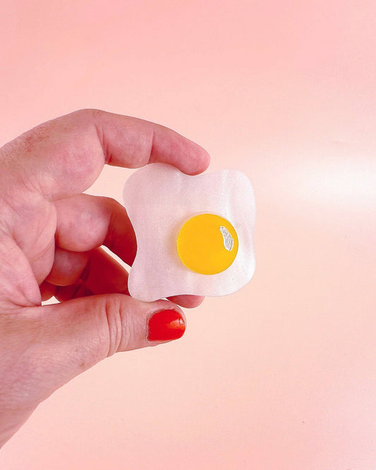 Over easy egg pop-up ruler handle