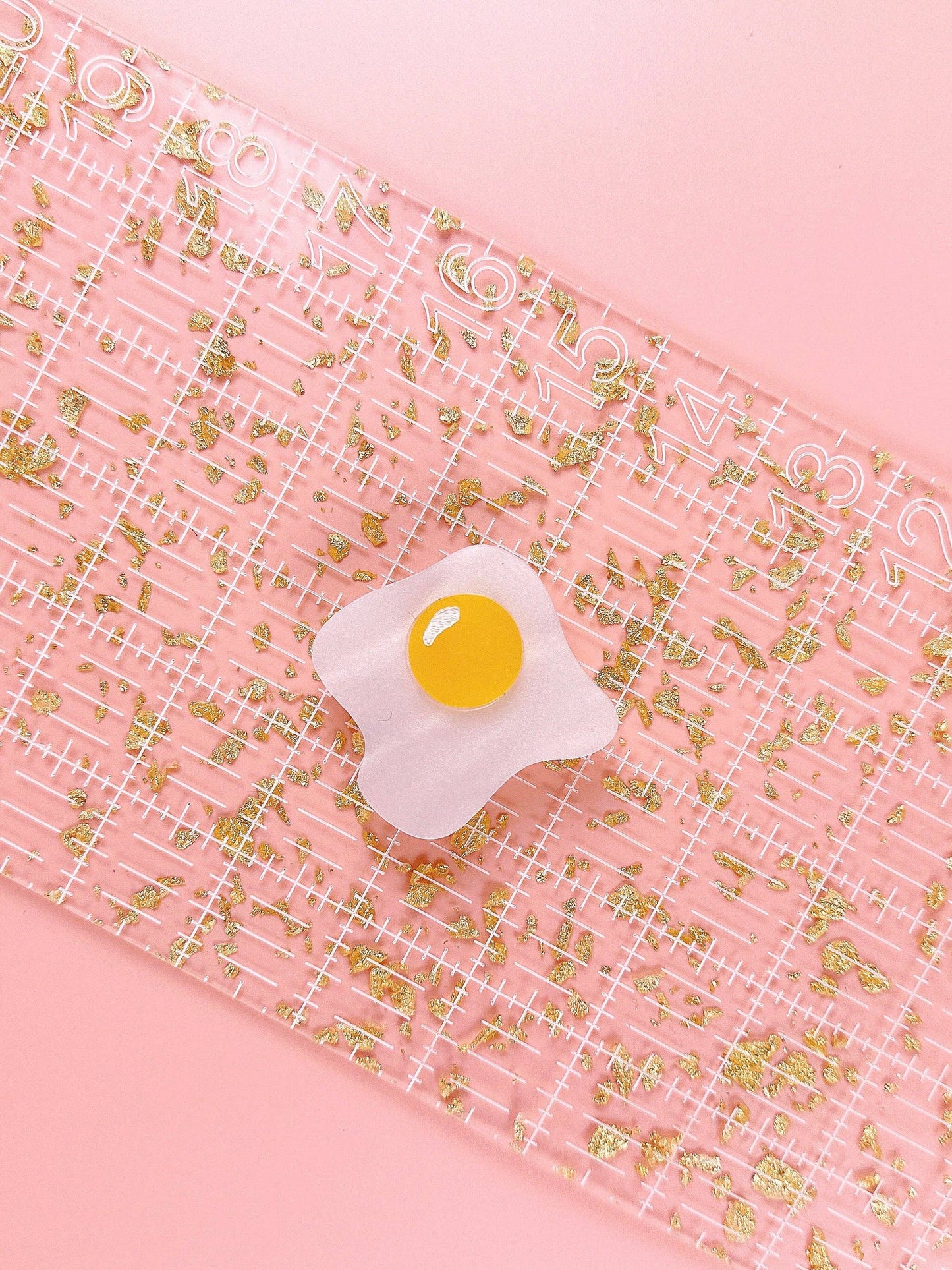 Over easy egg pop-up ruler handle